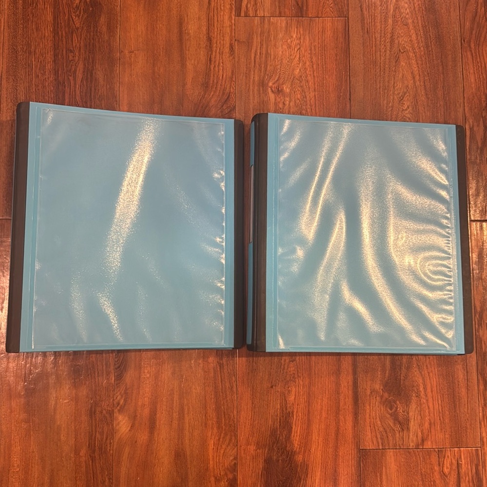 Two binders different sizes with tabs and dividers and labels